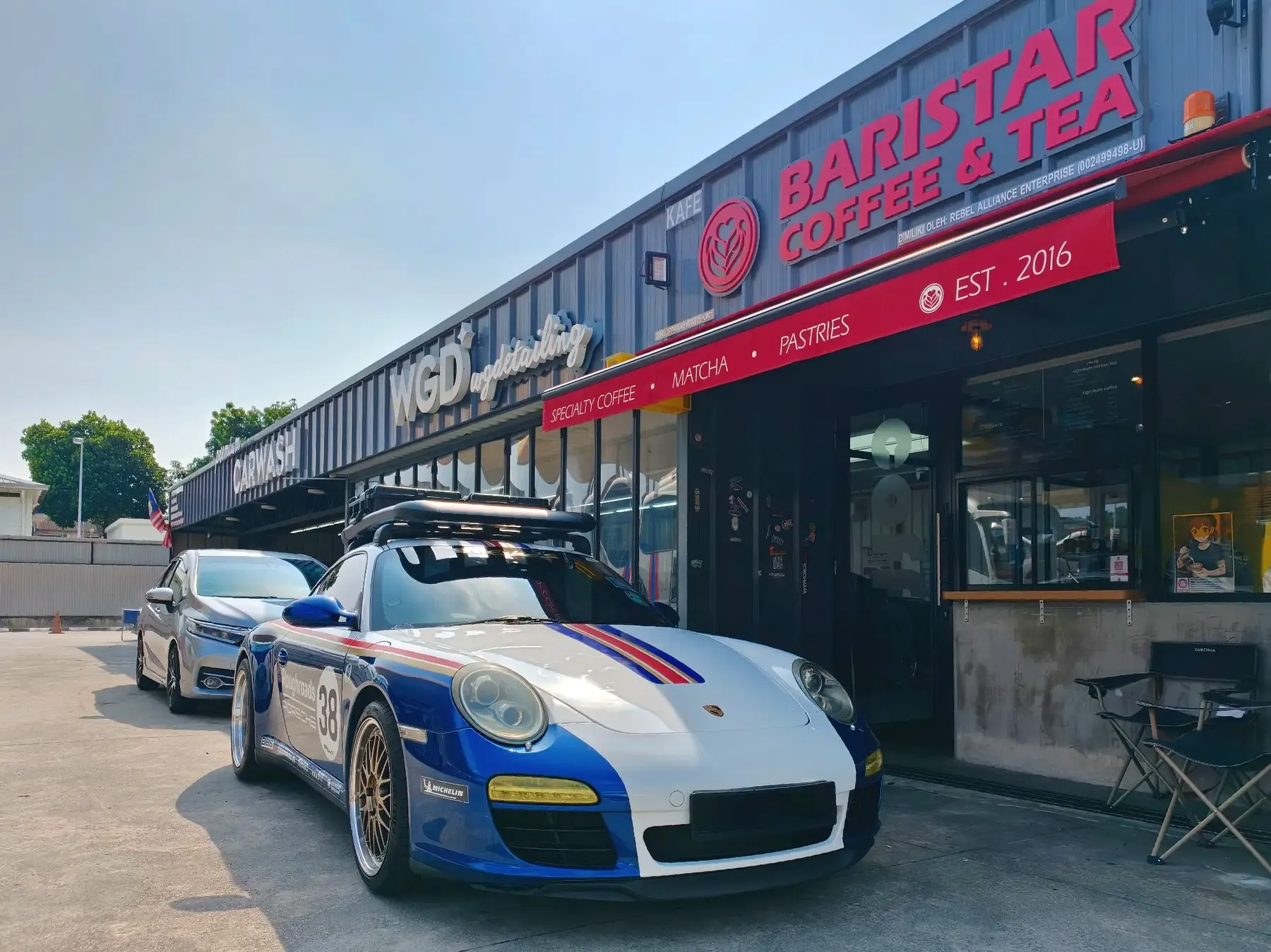 Porsche outside WG Detailing Cheras and the attached Baristar Coffee and Tea cafe