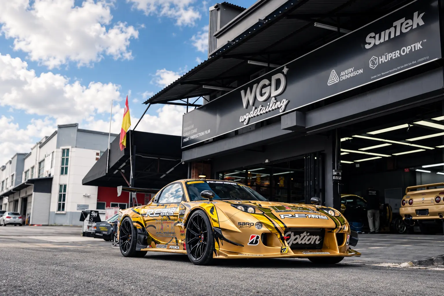 Gold Mazda RX-7 outside WG Detailing Kota Damansara